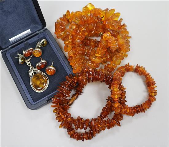 Assorted amber jewellery including necklaces, bracelet, pendant and earrings.